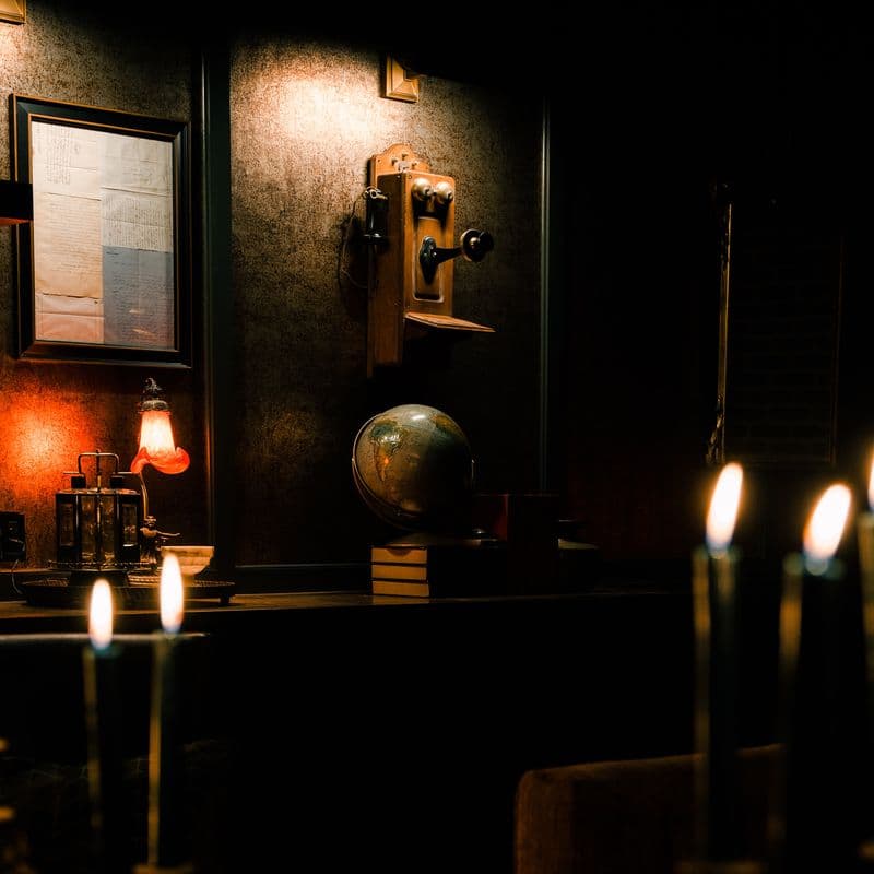 A candlelit speakeasy entrance